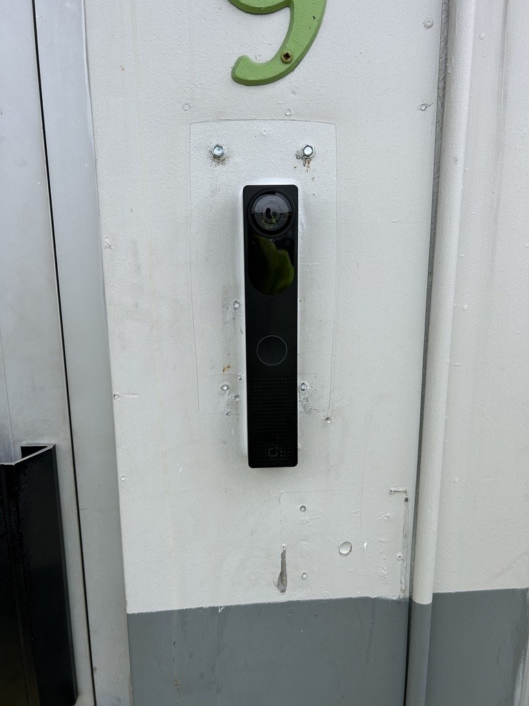 Commercial access control reader and intercom installed at a secured entry
